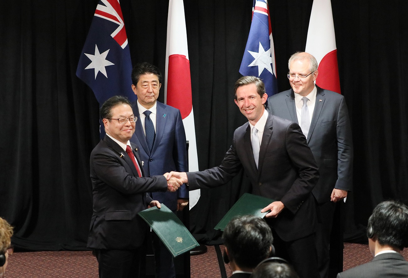 Photograph of the exchange of documents ceremony for Memoranda of Understanding